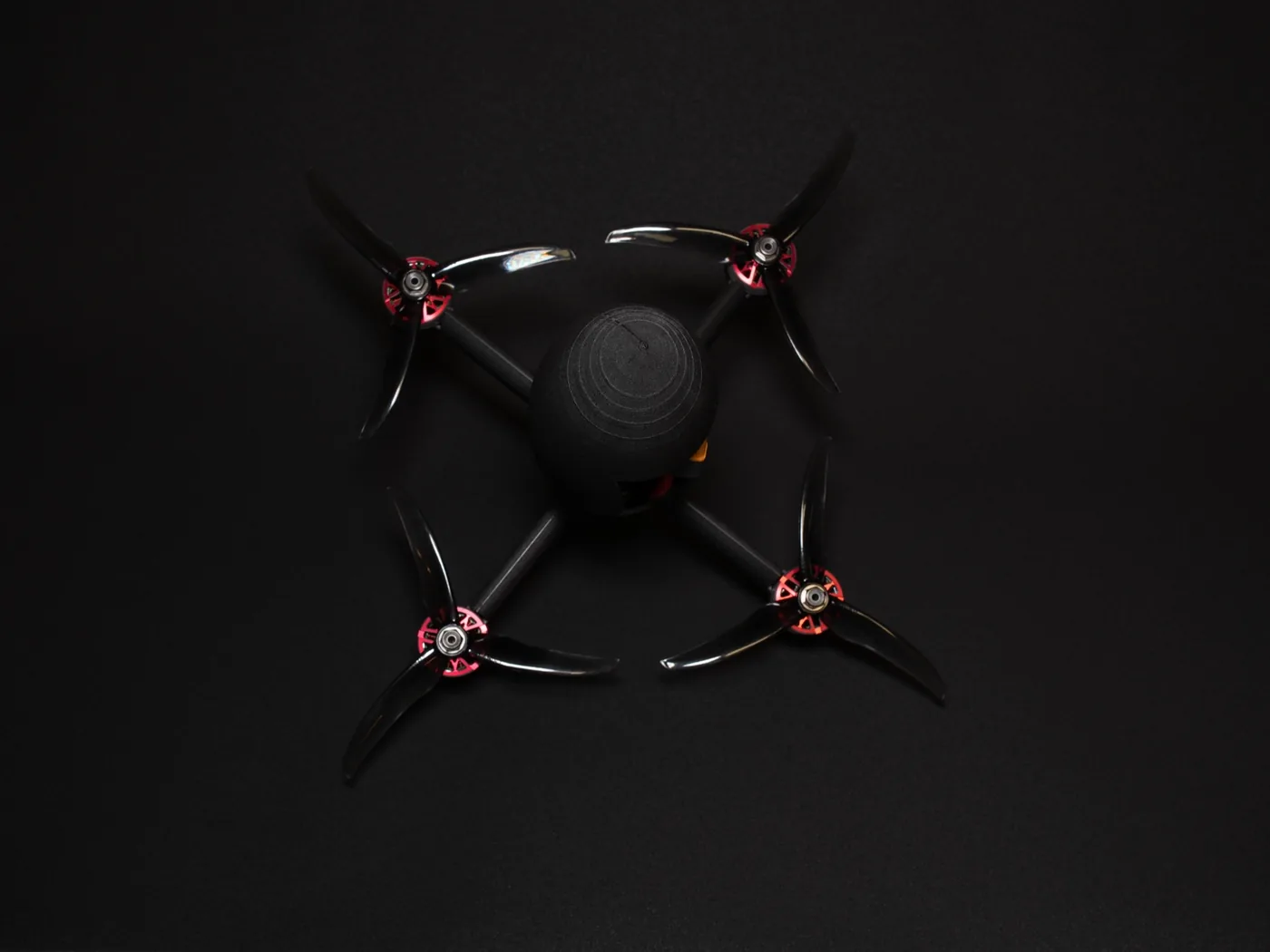 Top view of the flight-capable first drone revision showing its four-motor layout and printed central body